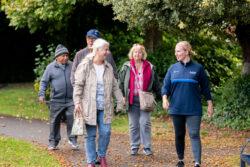 People enjoying an Active Tameside Health Walk in the park