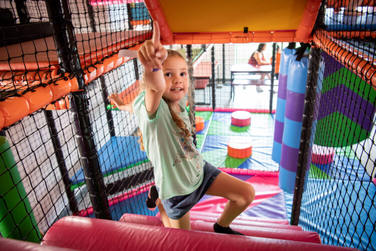 young girl in soft play