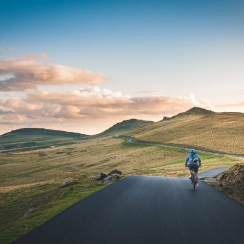 person cycling in countryside