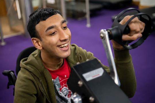 disabled man using a hand bike