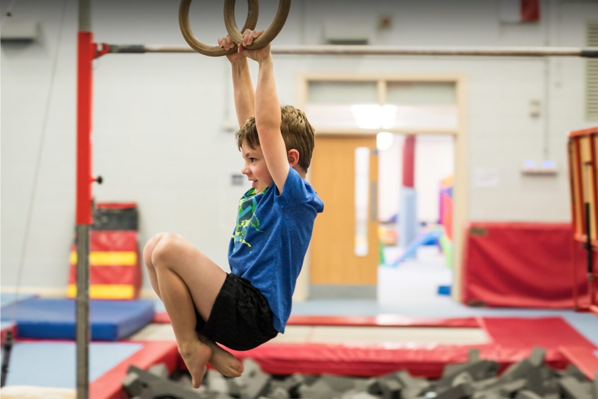 child on olympic rings