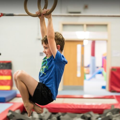 child on olympic rings