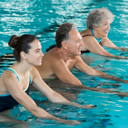 Seniors cycling on aqua bike