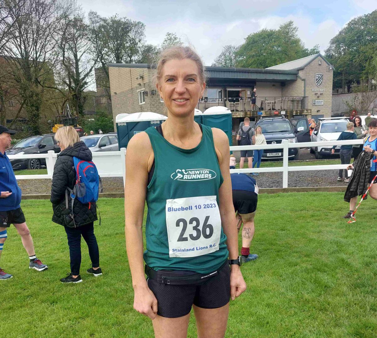 Jane posing for a photo at a running event